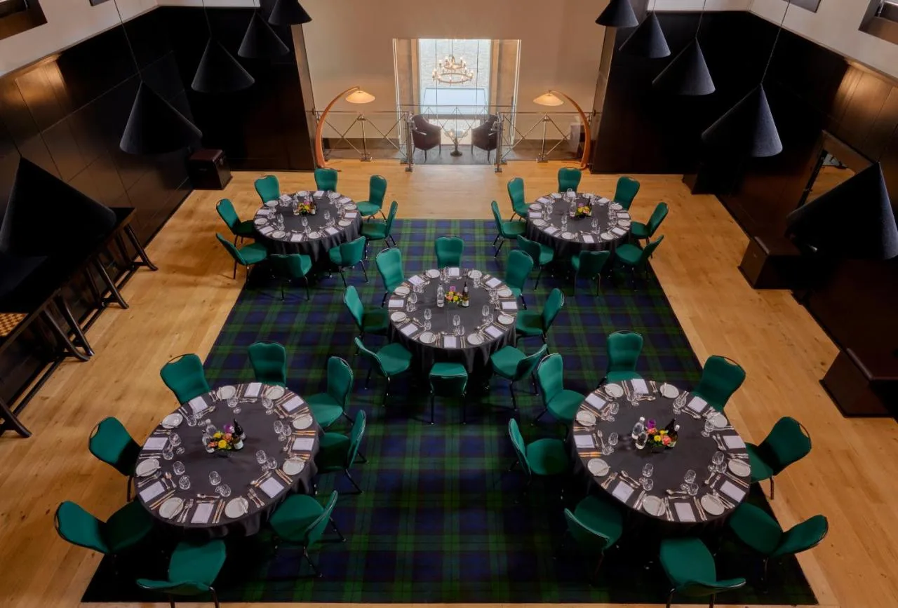 overhead view of a banquet hall with green chairs at Malmaison Oxford, Oxford